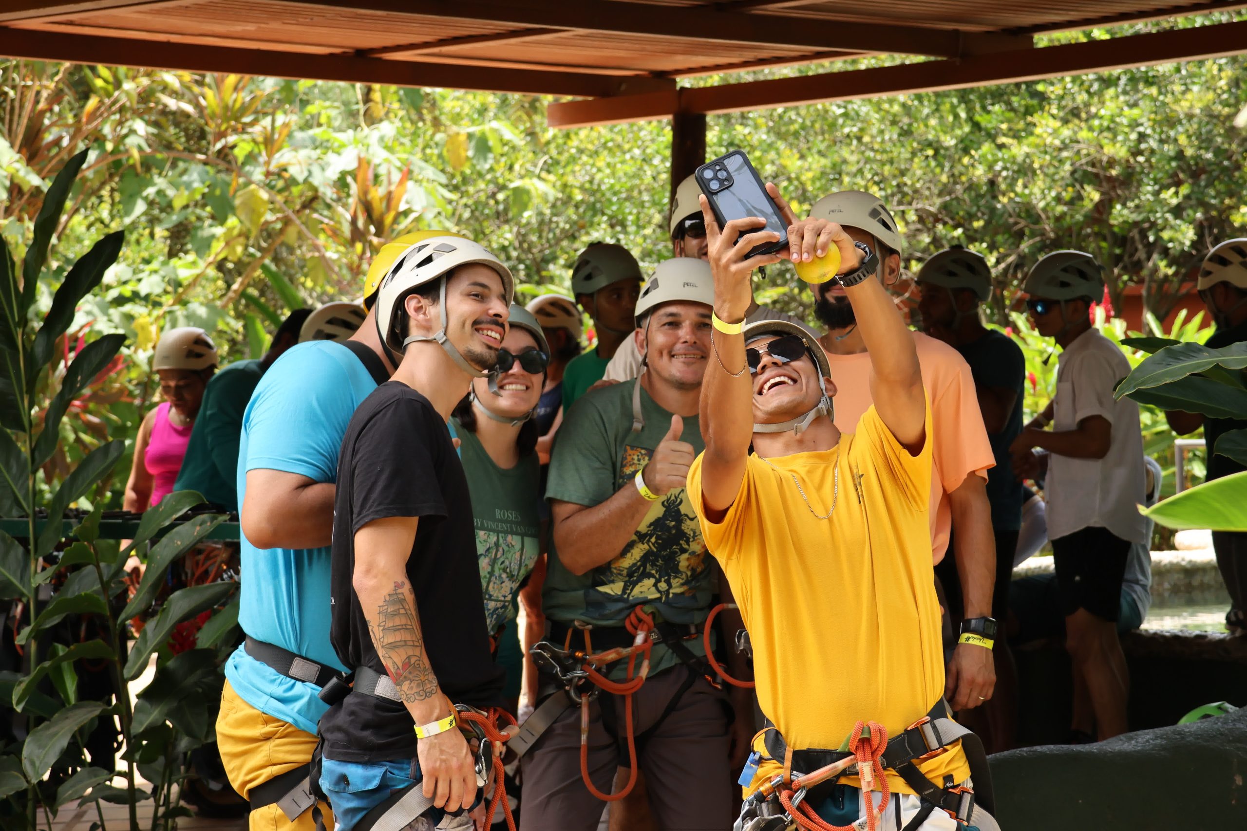 Group of people with helmets taking a happy selfie outdoors at Rincon Thermals Adventures Guanacaste Costa Rica